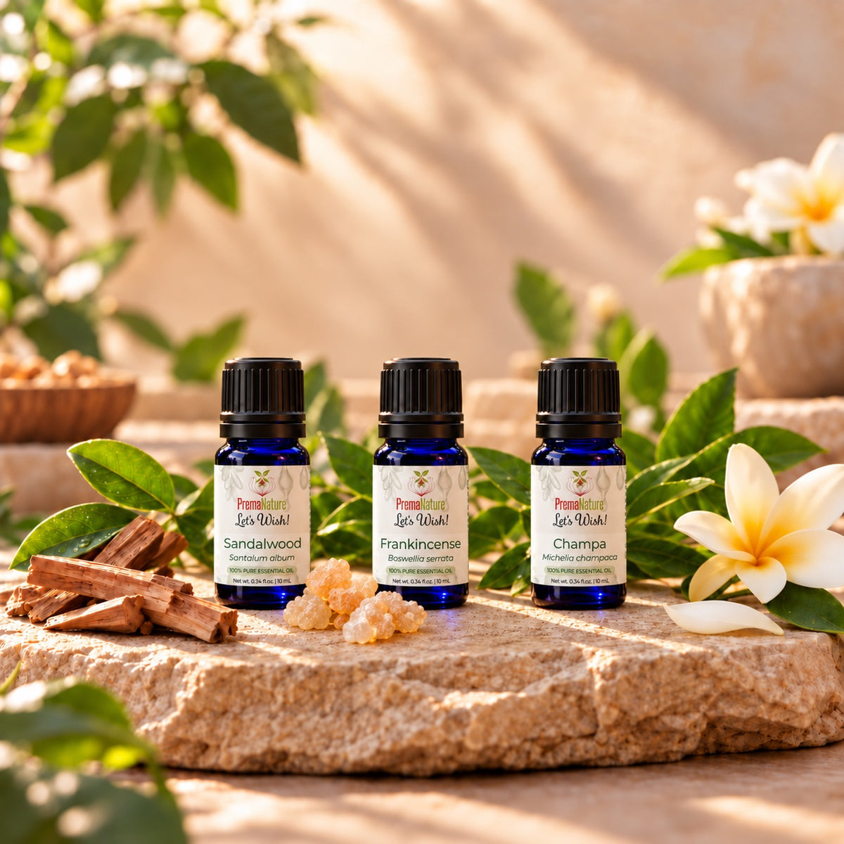 Sandalwood, Frankincense and Champa essential oils with sandalwood sticks, frankincense resin and champa flower