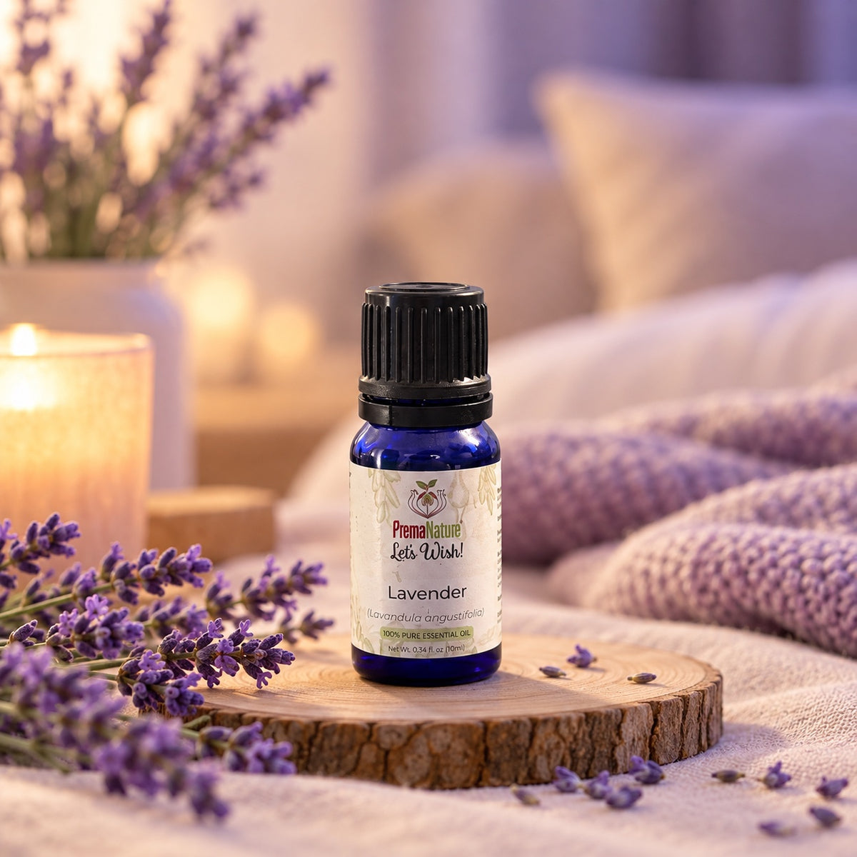 PremaNature Lavender essential oil 10 ml (Lavandula angustifolia) with lavender sprigs and a candle