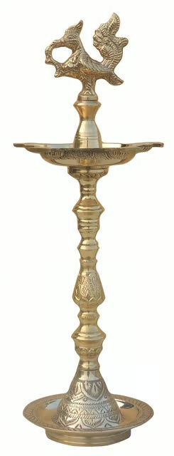 Standing brass kuthuvilakku oil lamp with an annam finial and turned ringed stem