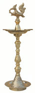 Standing brass kuthuvilakku oil lamp with an annam finial and turned ringed stem