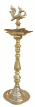 Tall standing brass kuthuvilakku oil lamp with annam finial and broad weighted base