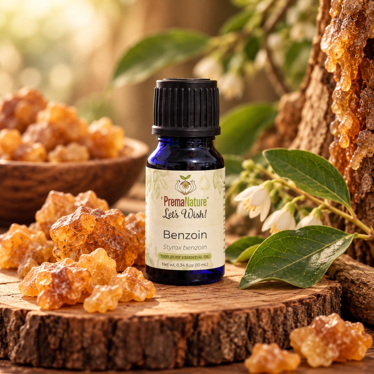 PremaNature Benzoin essential oil 10 ml (Styrax benzoin) with benzoin resin on a wooden slab