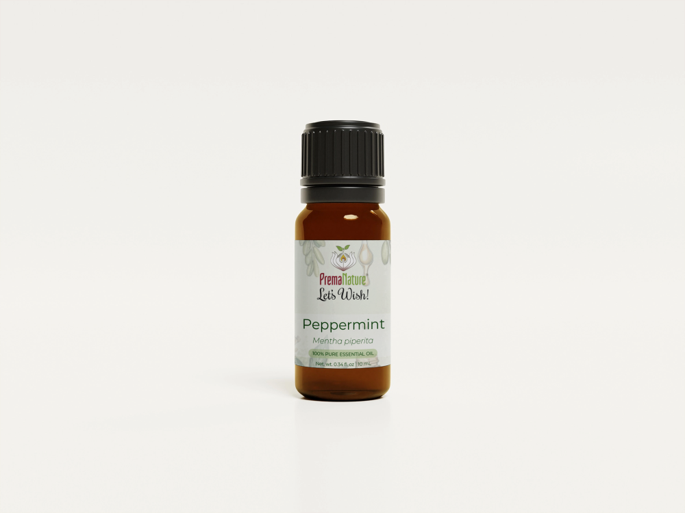 Peppermint essential oil bottle with mint leaves